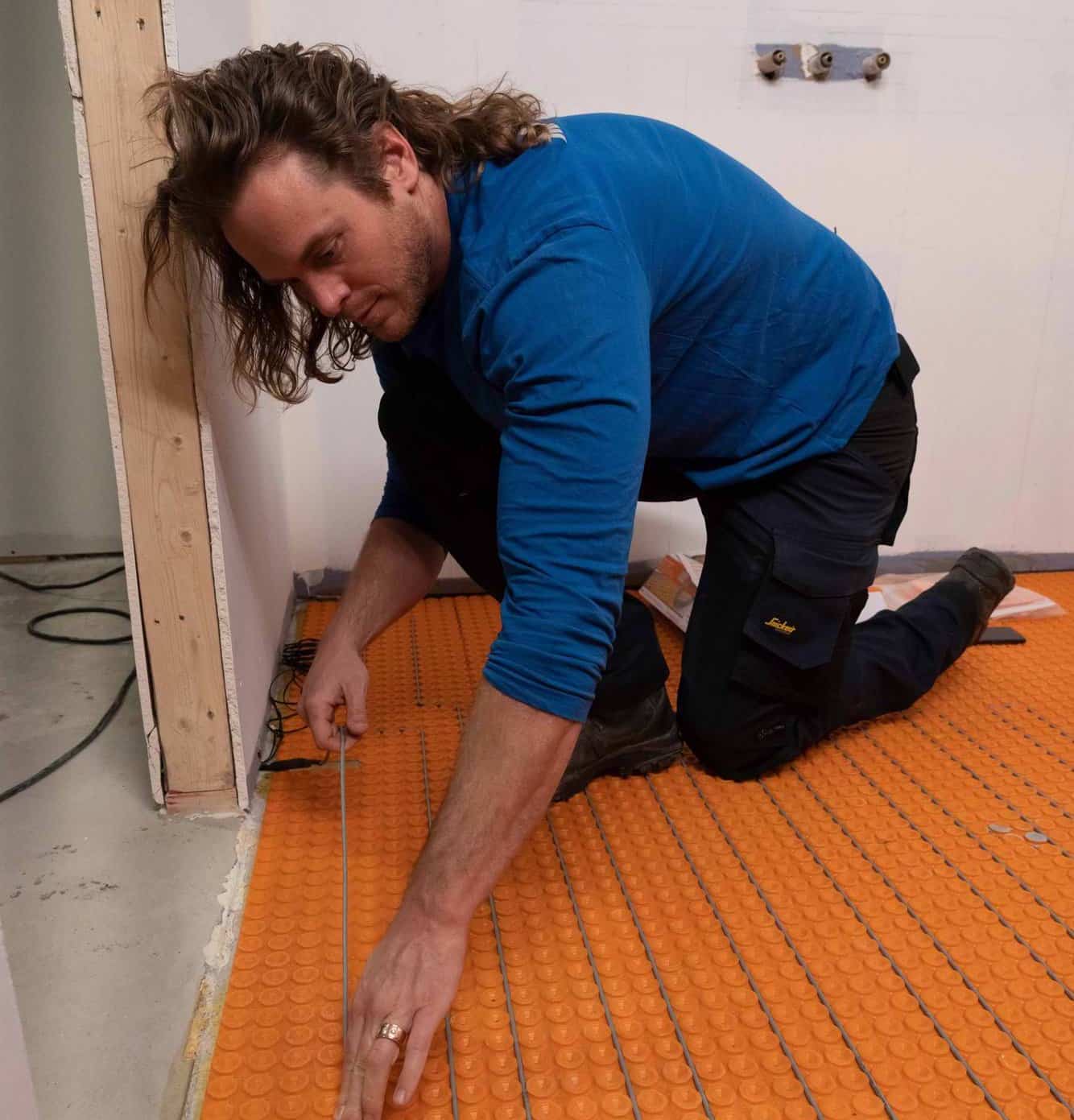 Mike Holmes Jr Installing Schluter Ditra-Heat in floor warming