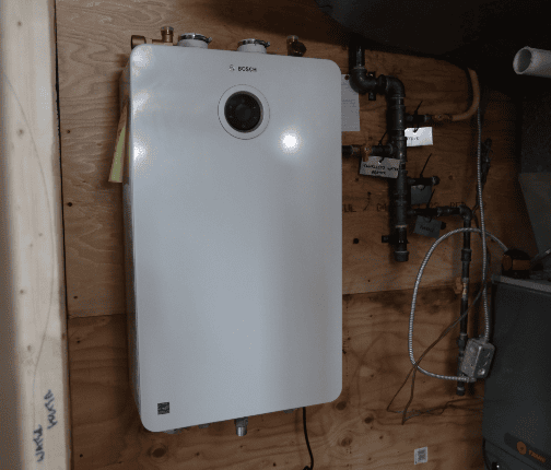 Bosch Greentherm-9900i-SE Tankless Water Heater installed on Holmes Family Rescue job site.