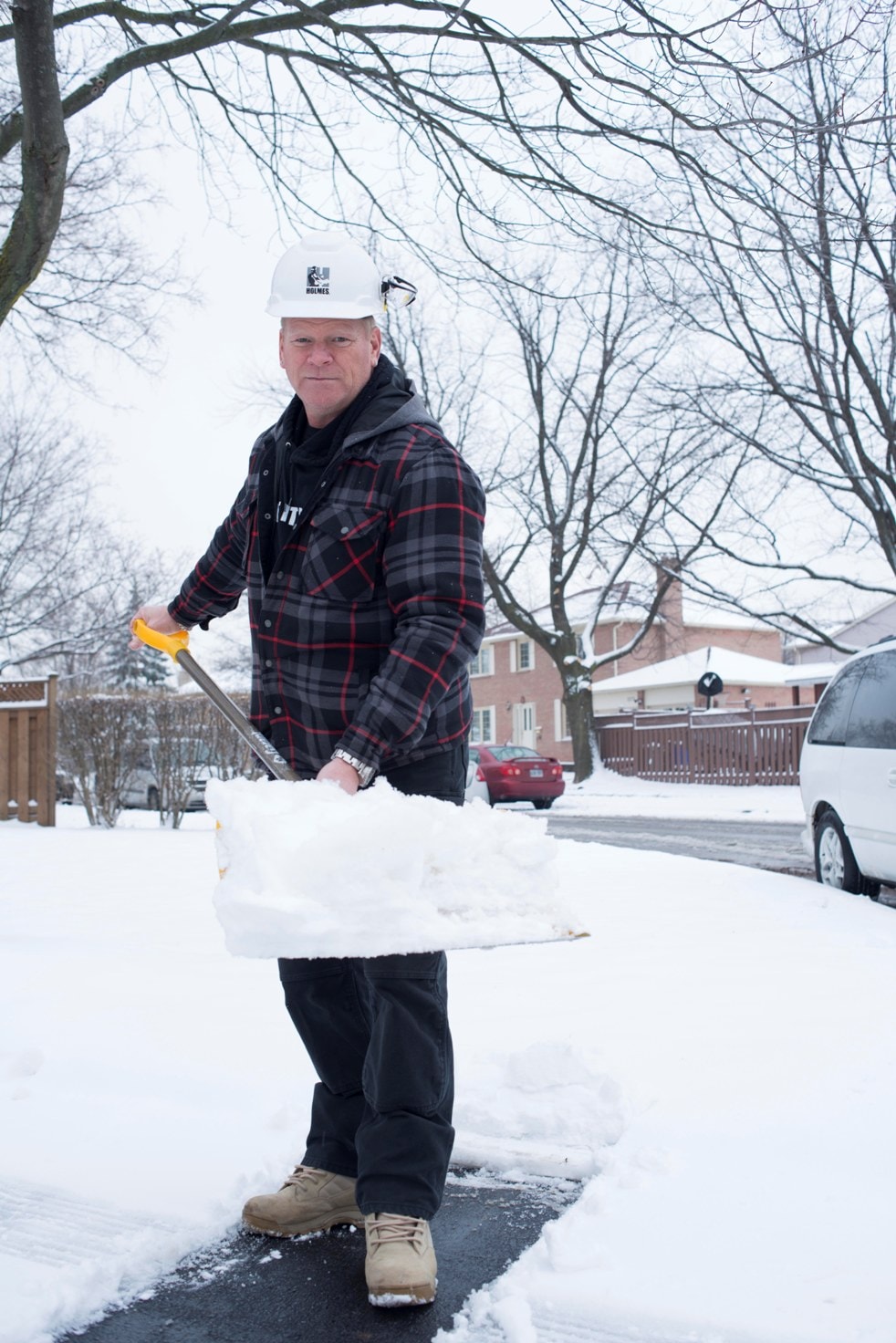 Mike Holmes shovelling snow