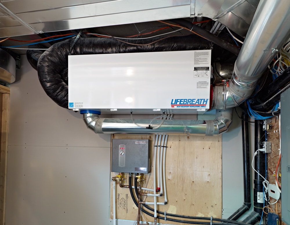 an hrv installed in a furnace room