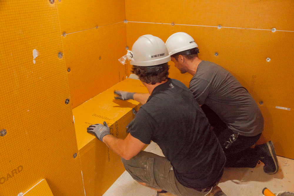 Schluter Systems provide the best in waterproofing products for all your renovation needs. Here, Michael and Derek work on a shower bench installed with Schluter Kerdi-Board from Holmes + Holmes, Season 3