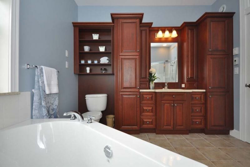 Custom wall cabinets provide lots of storage and shelves for display items by Prestiege Homes.
