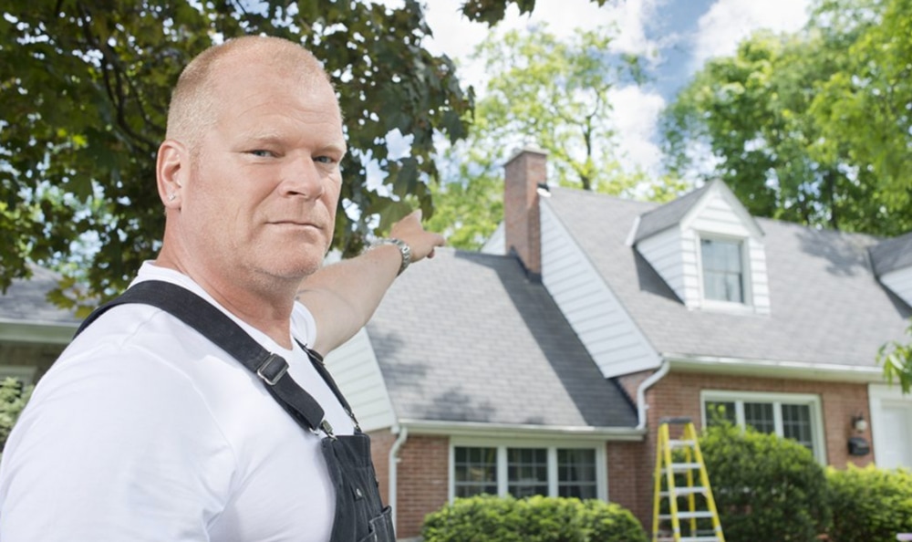 mike holmes pointing at a roof