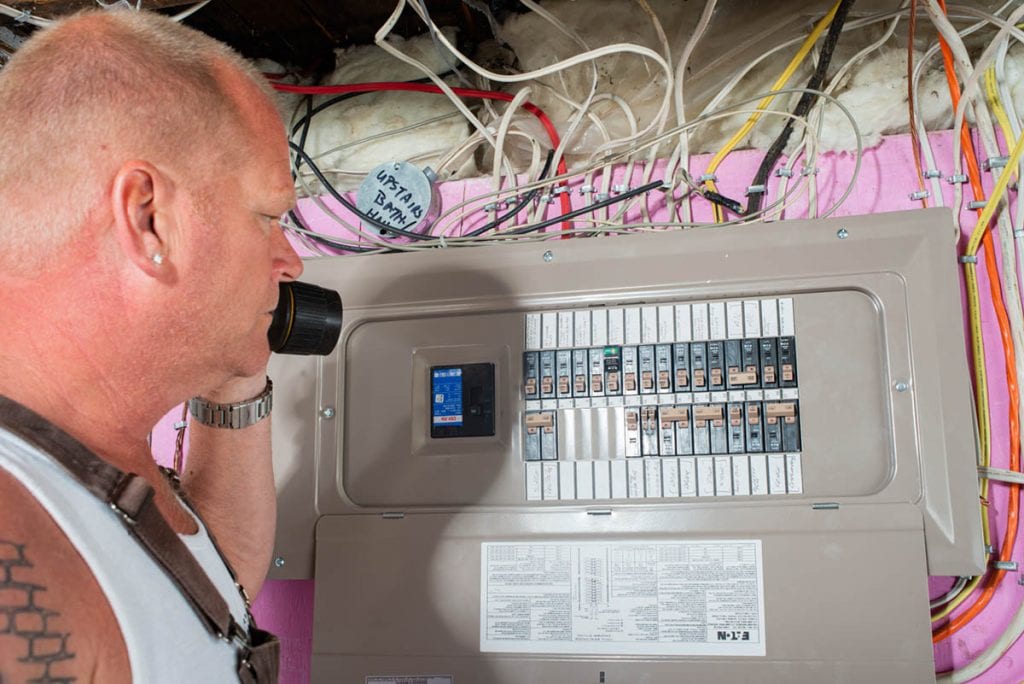 Mike Holmes Inspecting An Electrical Panel
