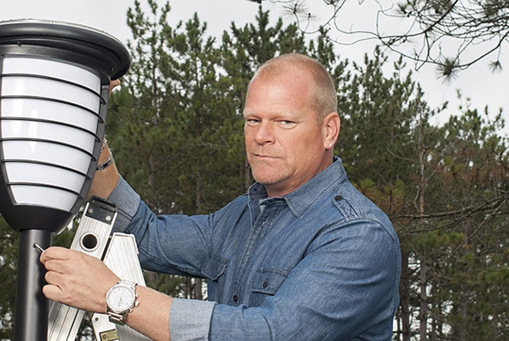 Mike Holmes installing solar outdoor lighting