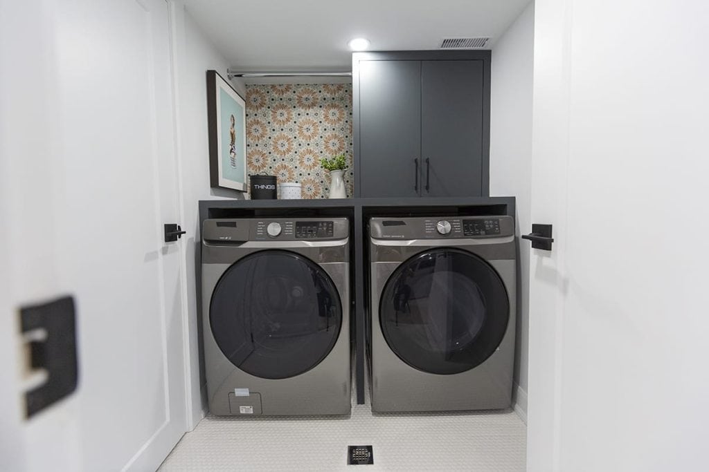 Laundry Room with Storage Above The Washer And Dryer. Photo from Holmes Family Rescue