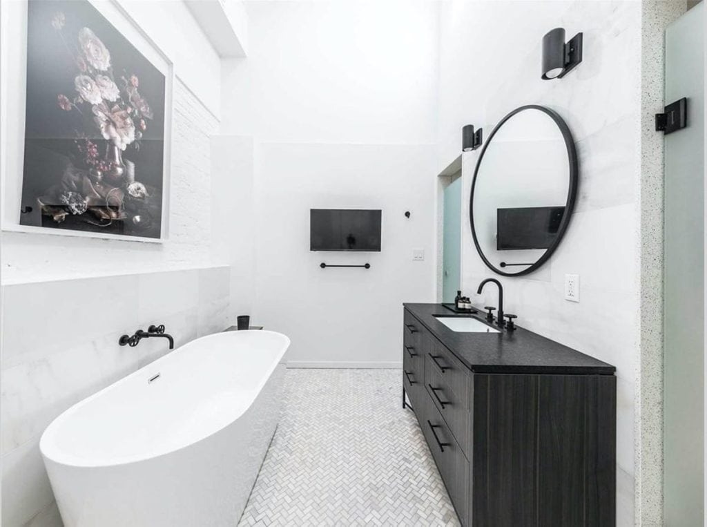 Black on black makes quite the statement to this modern bathroom by SalDan Construction Group, Holmes Approved Homes Builder