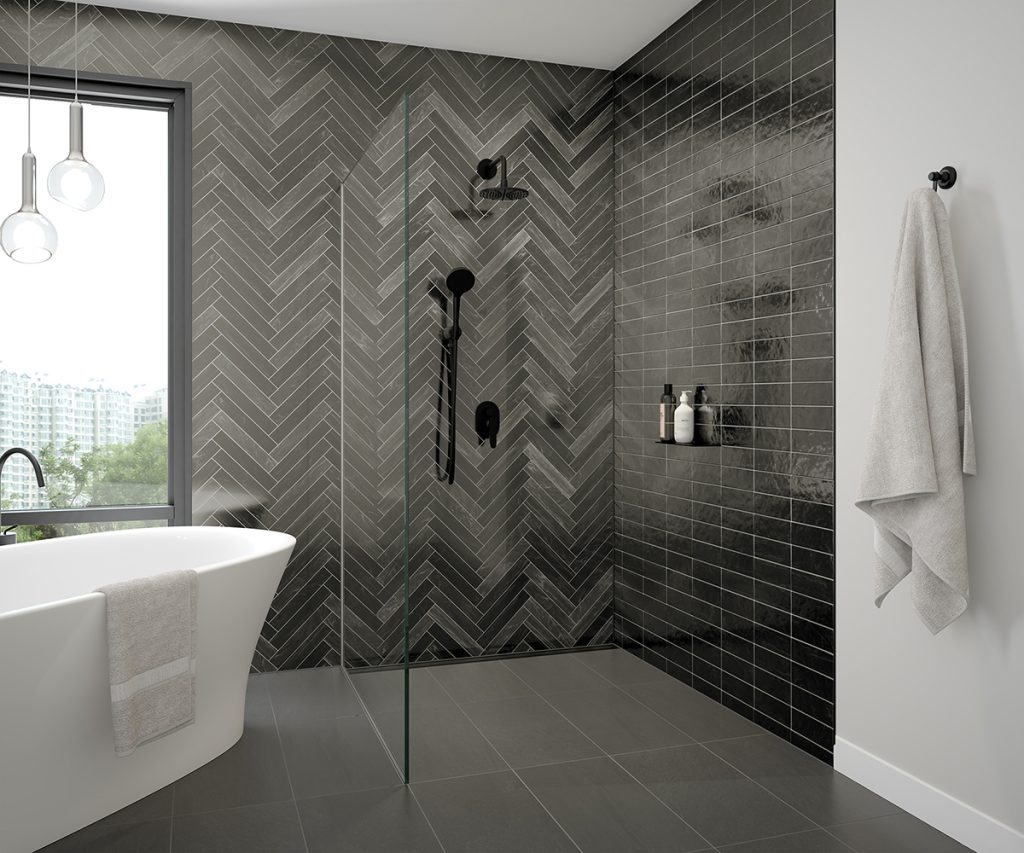 This curbless shower features a Schluter Linear Drain and a matching matte black shelf.