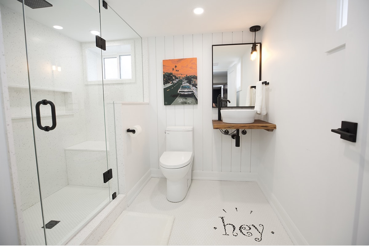 photo of a basement bathroom with shower bench