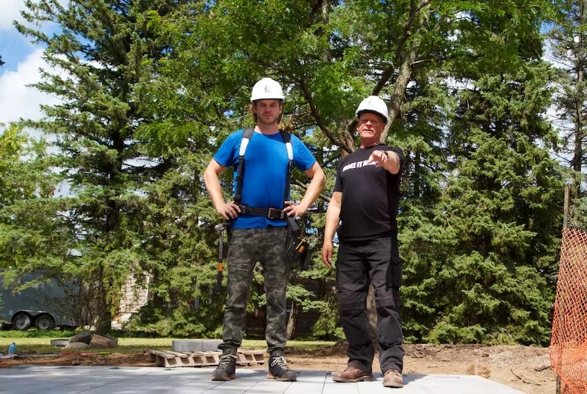 Mike Holmes and Mike Holmes Jr Outdoors Inspecting Work