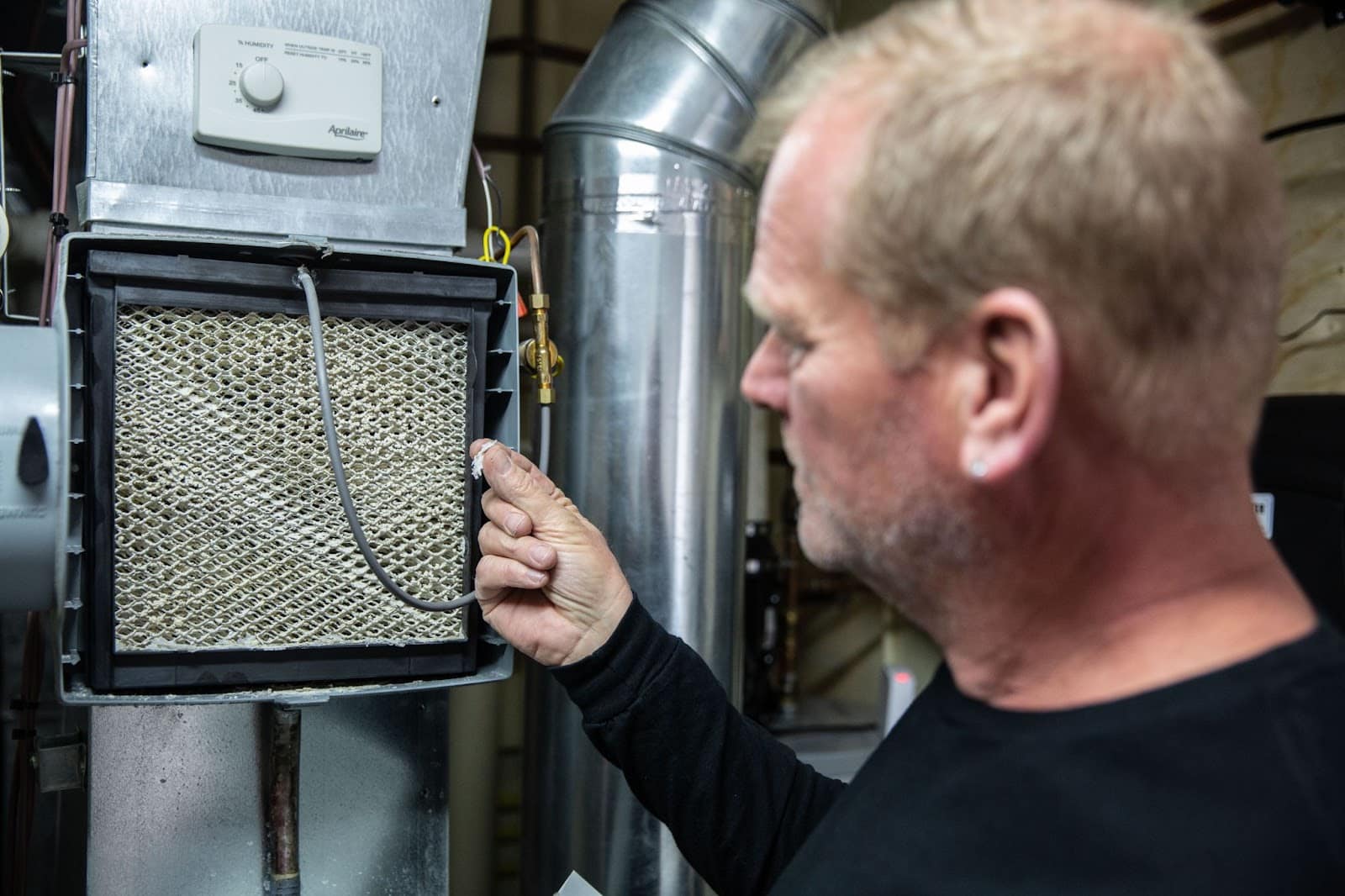 Mike Holmes Noticing White Scale On His Humidifier Filter