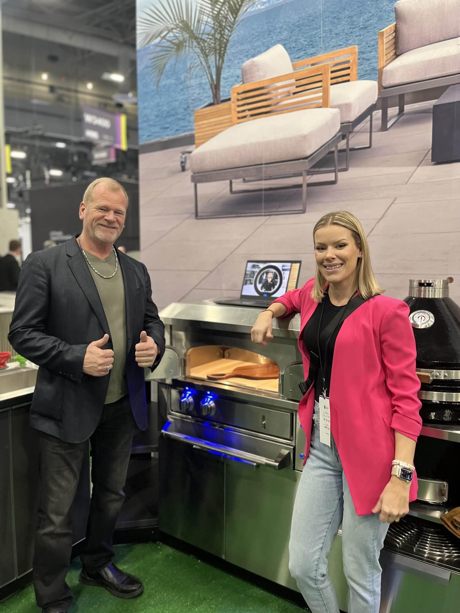 Mike Holmes and Sherry Holmes with NewAge pizza oven at IBS 2023.