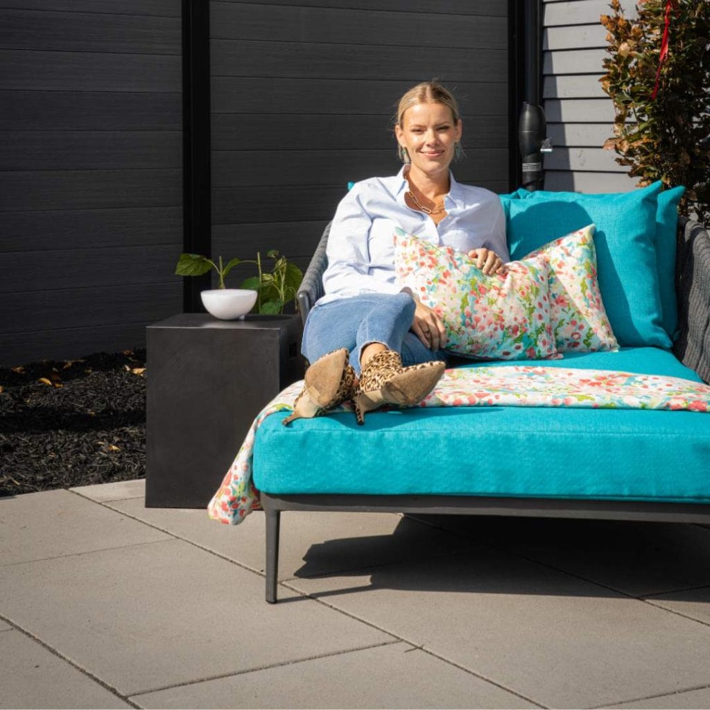 Sherry Holmes on lounge chair from backyard project on Holmes Family Rescue Season 2.