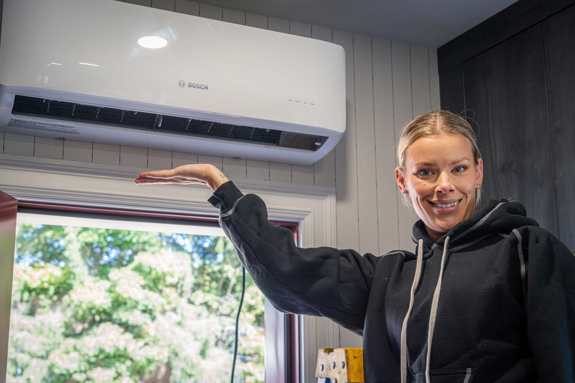 Sherry Holmes with a Bosch Mini-Split Climate 5000 heat pump installed on Holmes Project