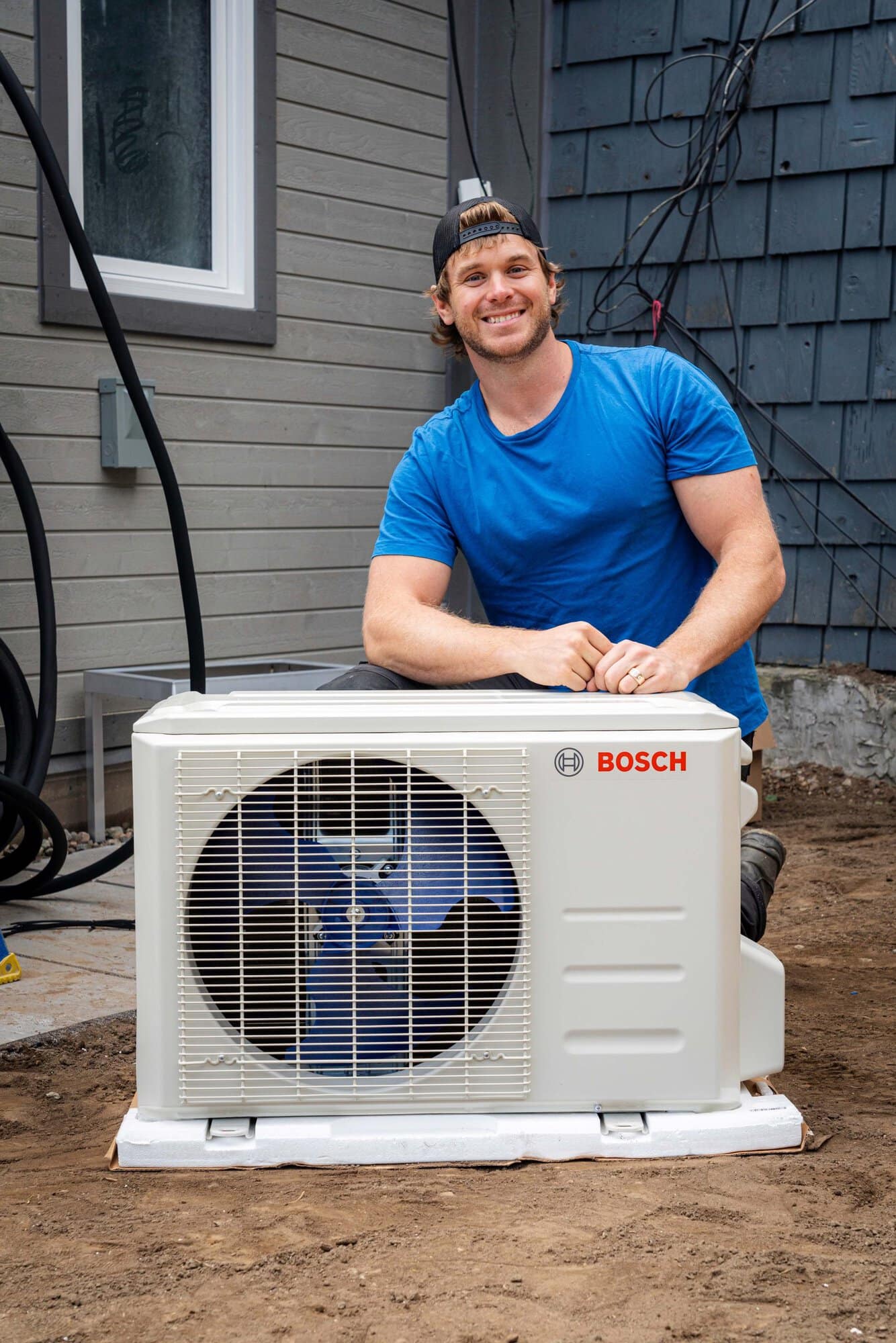 Mike Holmes Jr with Bosch Mini-Split Climate 5000 heat pump Outdoor Unit