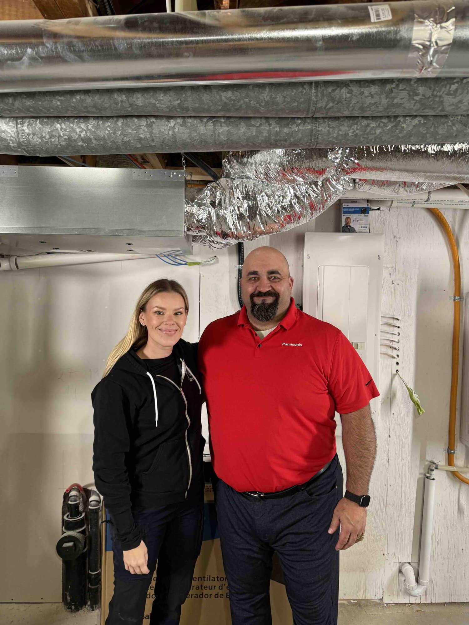 Sherry Holmes with Panasonic Indoor Air Quality expert installing ERV