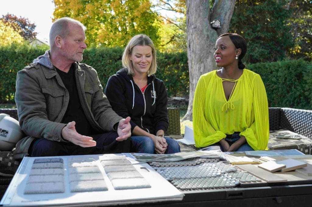 Mike and Sherry Holmes discussing with an interior designer