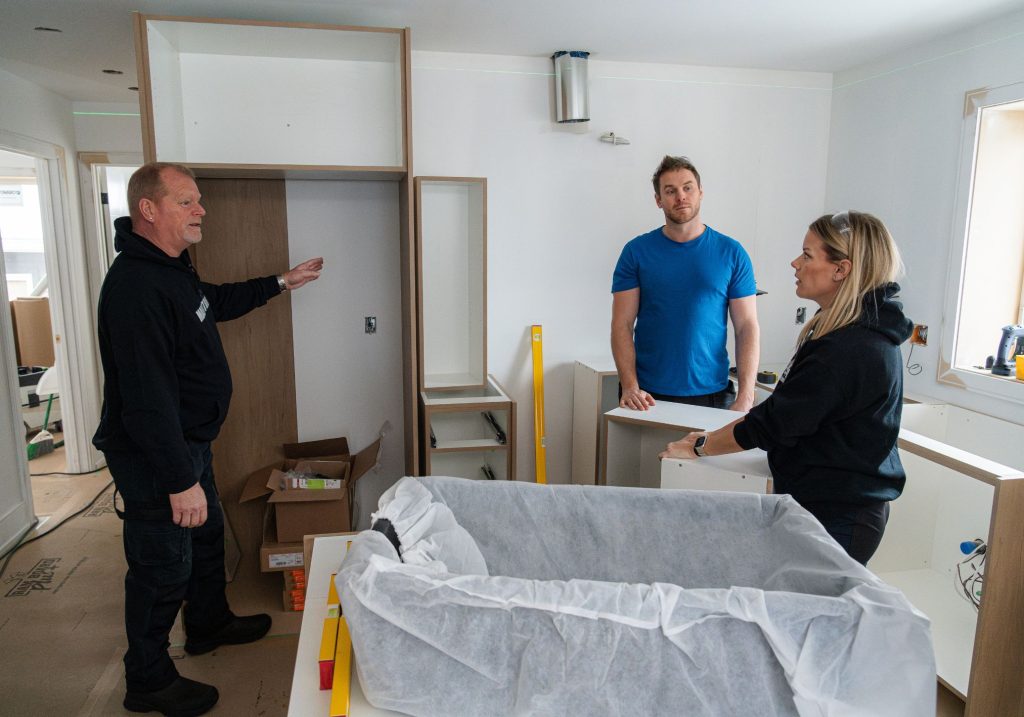 Mike Holmes, Mike Holmes Jr and Sherry Holmes Installing Kitchen for Holmes On Homes Building A Legacy