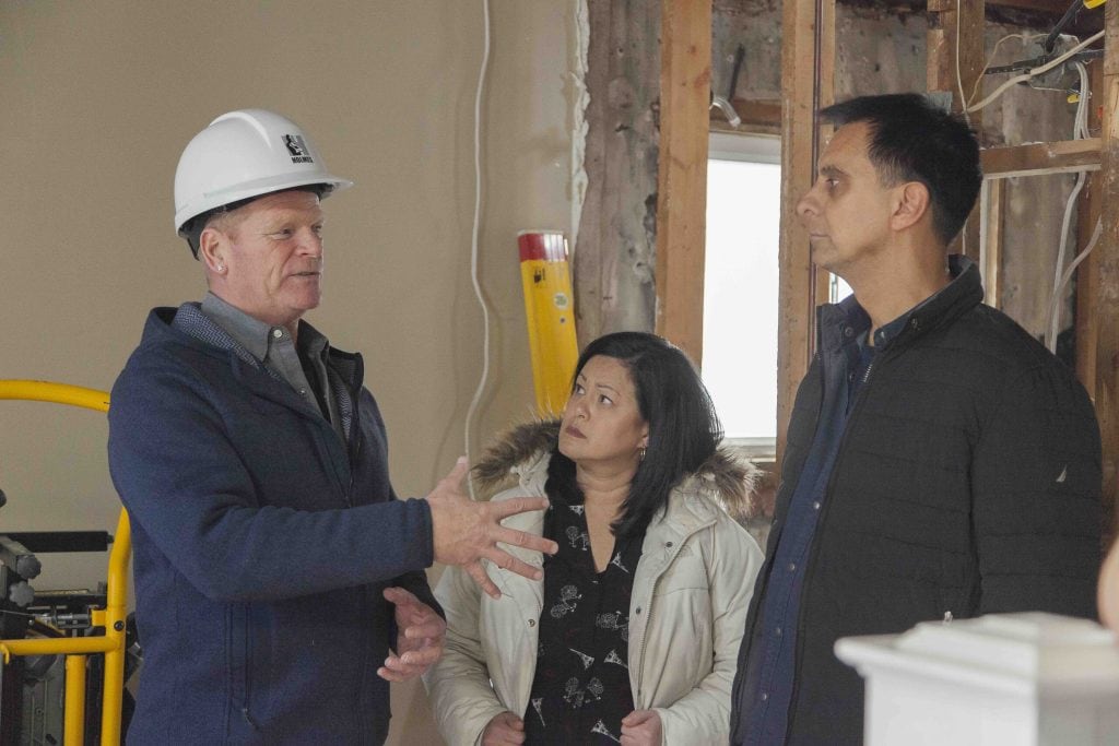 Mike Holmes with Patricia and Rod, homeowners on Holmes and Holmes City Barn project