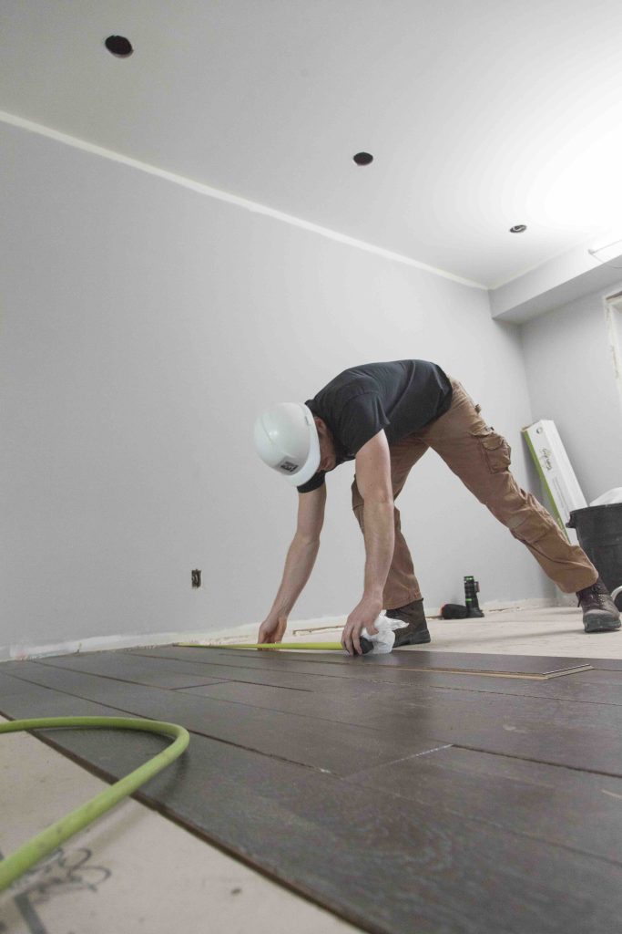 As seen on Holmes and Holmes Season 3 - City Barn project. Mike Holmes Jr installing hardwood flooring.